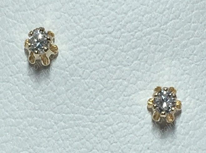 Buttercup design set with .08pt tcw diamonds available in 14kt white or yellow gold.