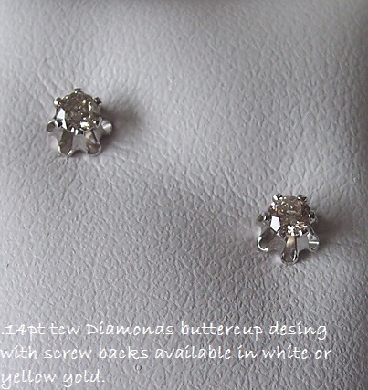Genuine Diamond .14pts - 14kt White Gold - Buttercup Design.
With Screw Backs.