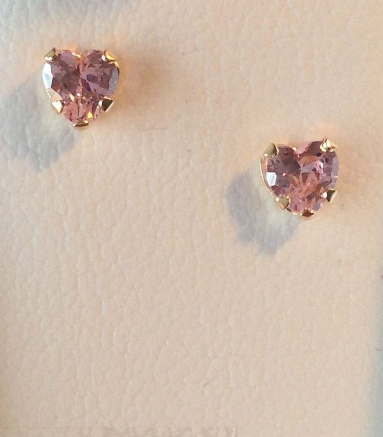 Pink or White Heart Shape Cubic Z 
Set in 14kt Yellow gold With Screw Backs.