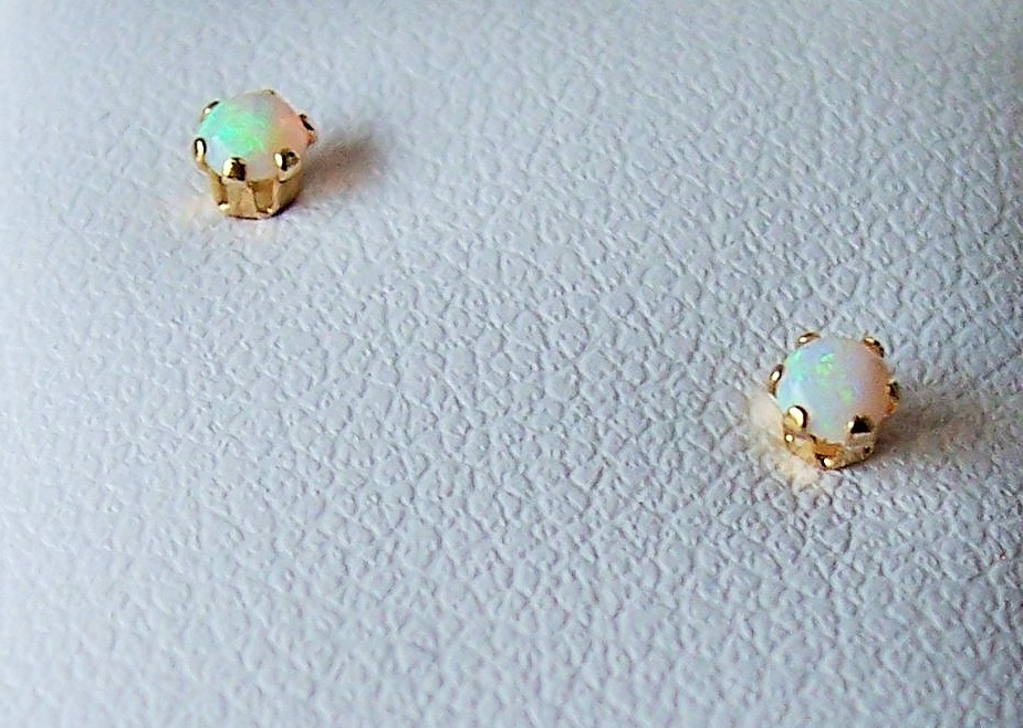 Genuine Opal
October Birthstone
14KT Yellow Gold
With Screw Backs.